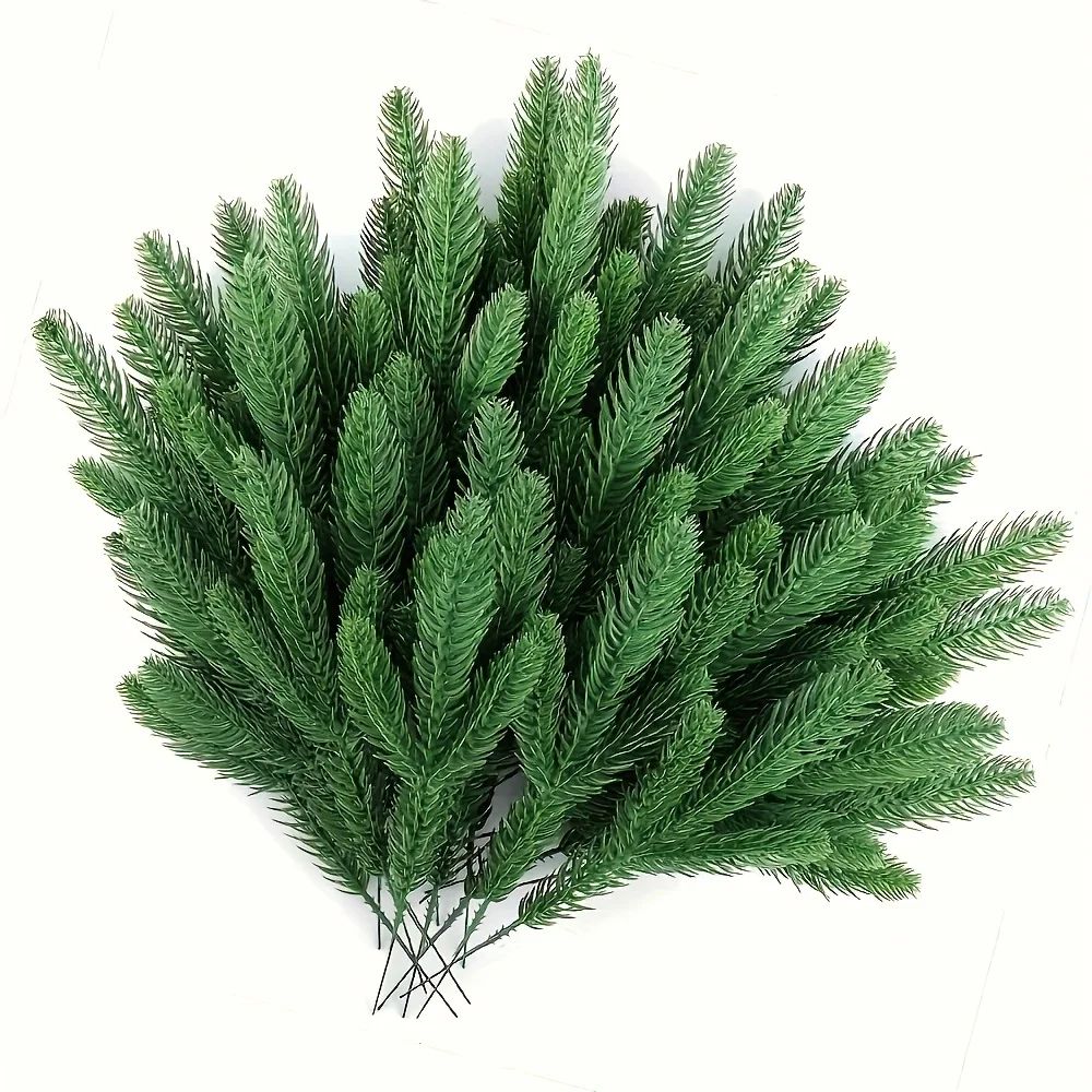 A selection of 60 artificial pine trees, with plastic green