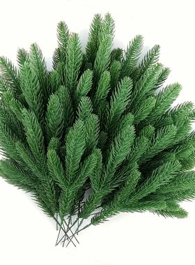 A selection of 60 artificial pine trees, with plastic green