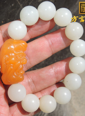 方言蒋喜帝王黄玉籽料独配带墨点