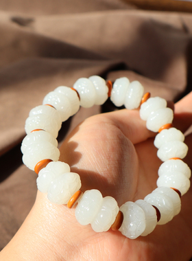 新疆且末料白玉巧雕双头莲花手串