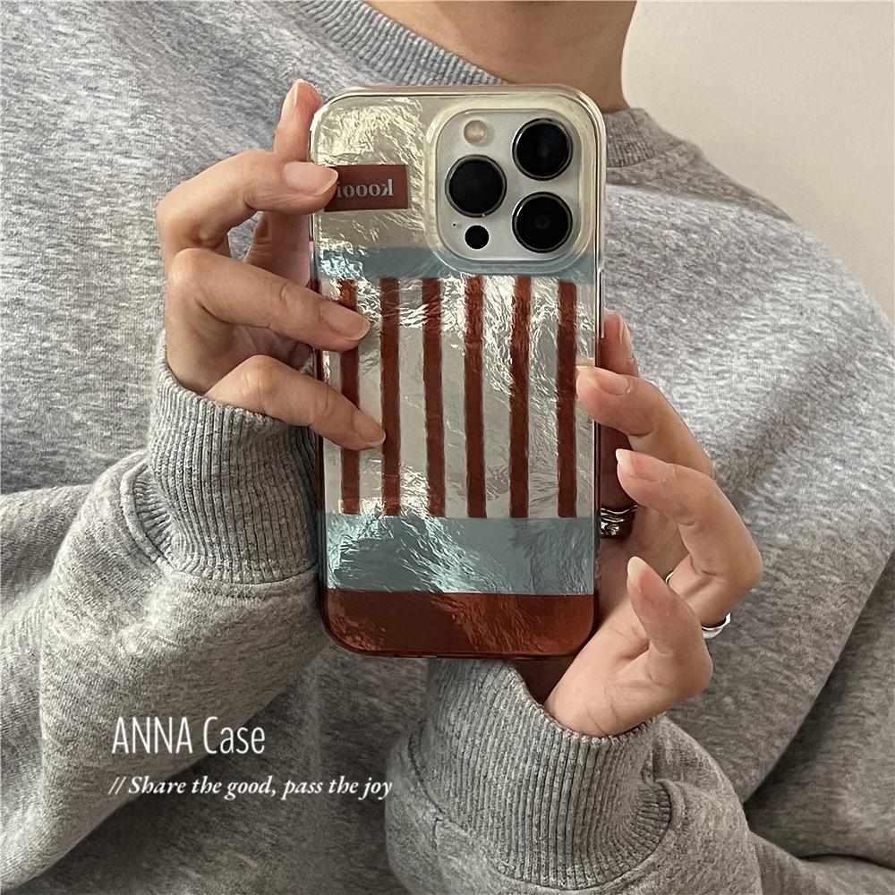 蓝棕拼色条纹锡纸纹苹果16手机壳