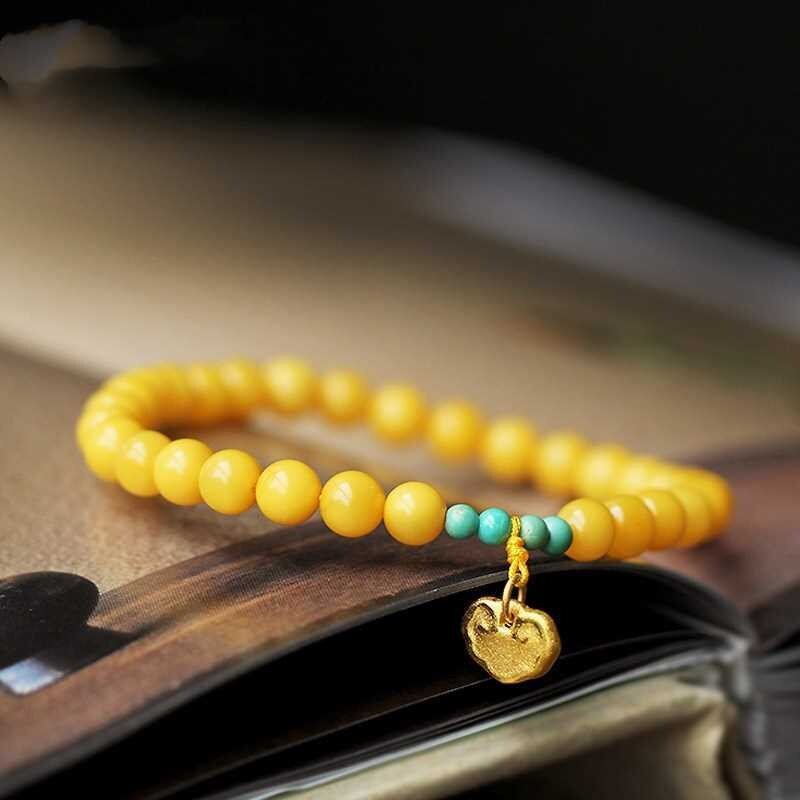 新款鸡油黄蜜蜡手链招时纳福吊牌桃花手串小众设计送母亲闺蜜礼物