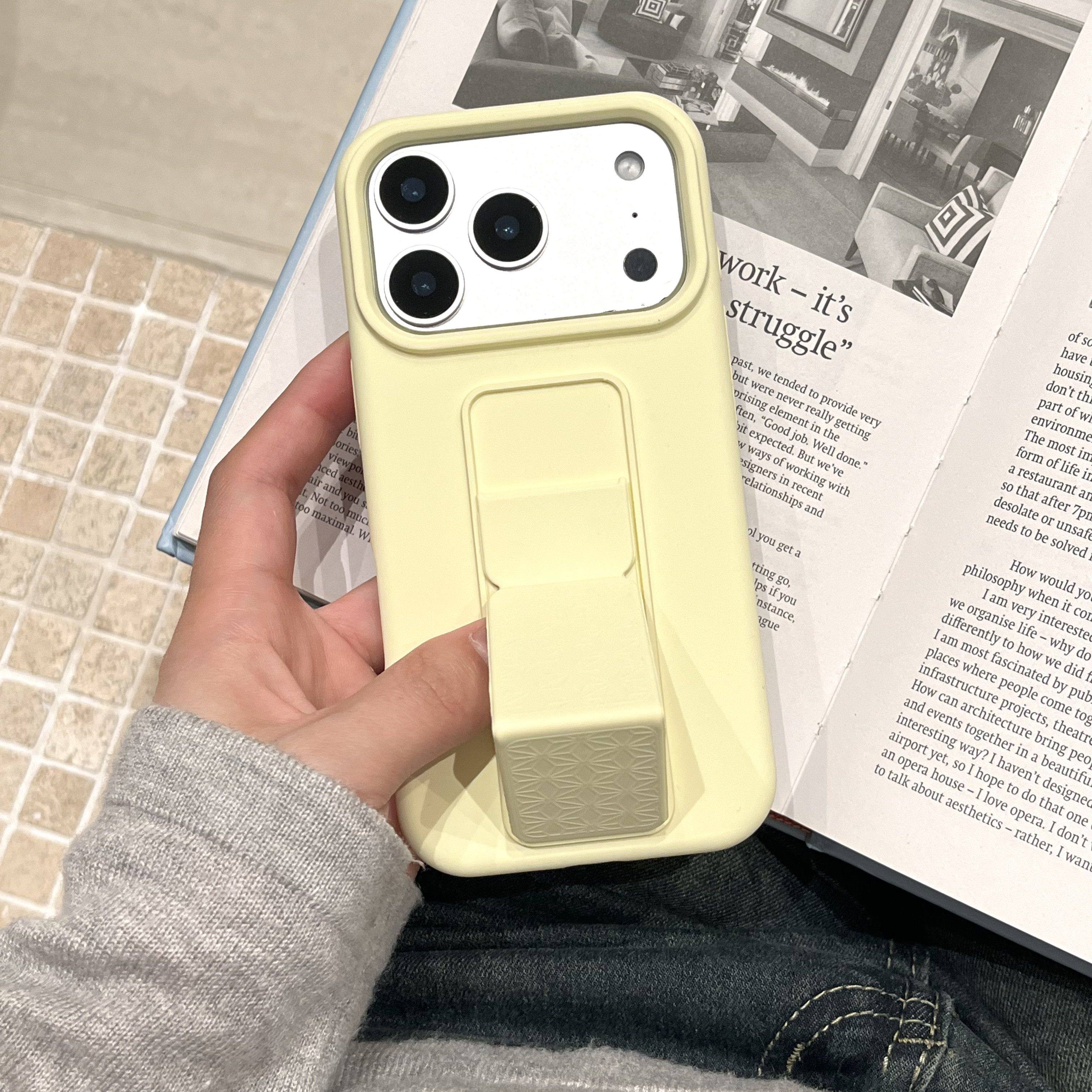 适用苹果17promax伸缩可折叠支架手机壳16pm纯色液态硅胶软糯亲肤15pro高品质耐脏iphone14/13全包防摔保护套