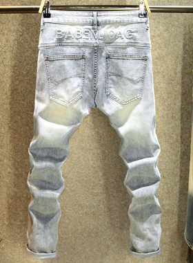 高街立体压花夏季牛仔裤男弹力修身小脚裤浅蓝色潮牌设计感长裤子