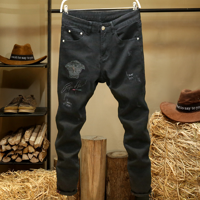纯黑色高端牛仔裤男士修身小脚裤大牌图案徽章刺绣磨破工艺裤子男