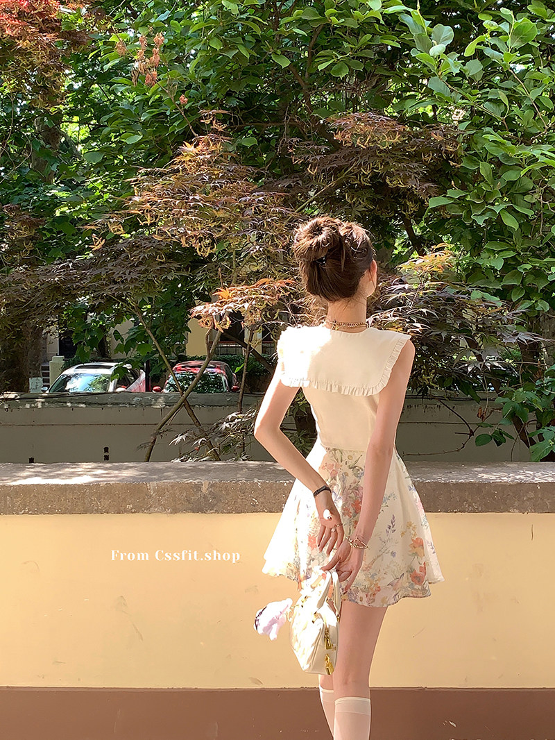 Woman wearing a light floral summer dress outdoors