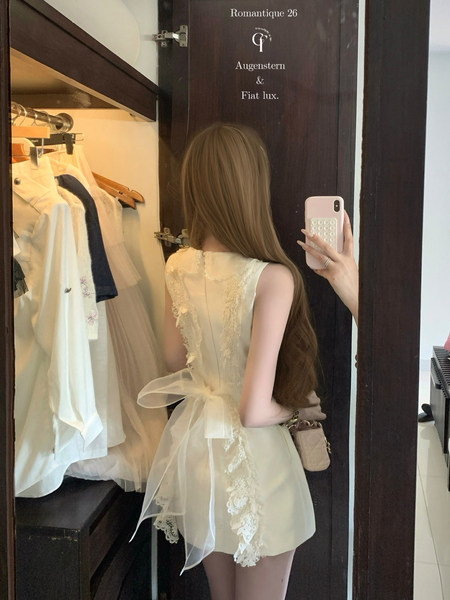Cream lace-trim sleeveless dress worn in a mirror selfie