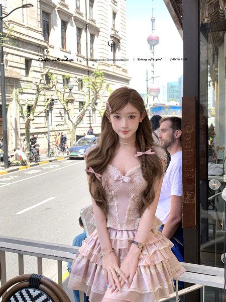 Pink frilly lace dress worn by a model outdoors
