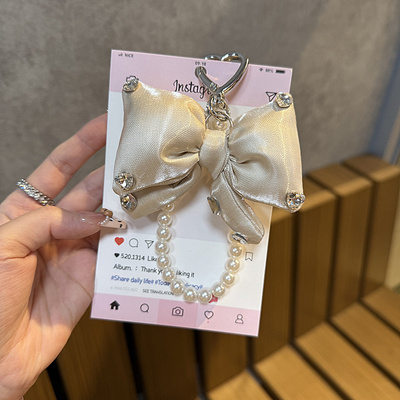 ins日韩闪钻奶白蝴蝶结珍珠链条包包挂件个性创意少女心新款