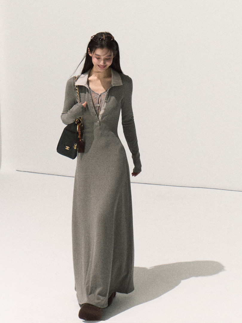 Grey long-sleeve maxi dress worn by a model