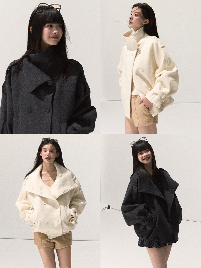 Models wearing oversized double-breasted coats in black and cream