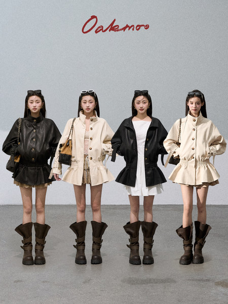 Four models wearing black and beige jackets with skirts and tall boots