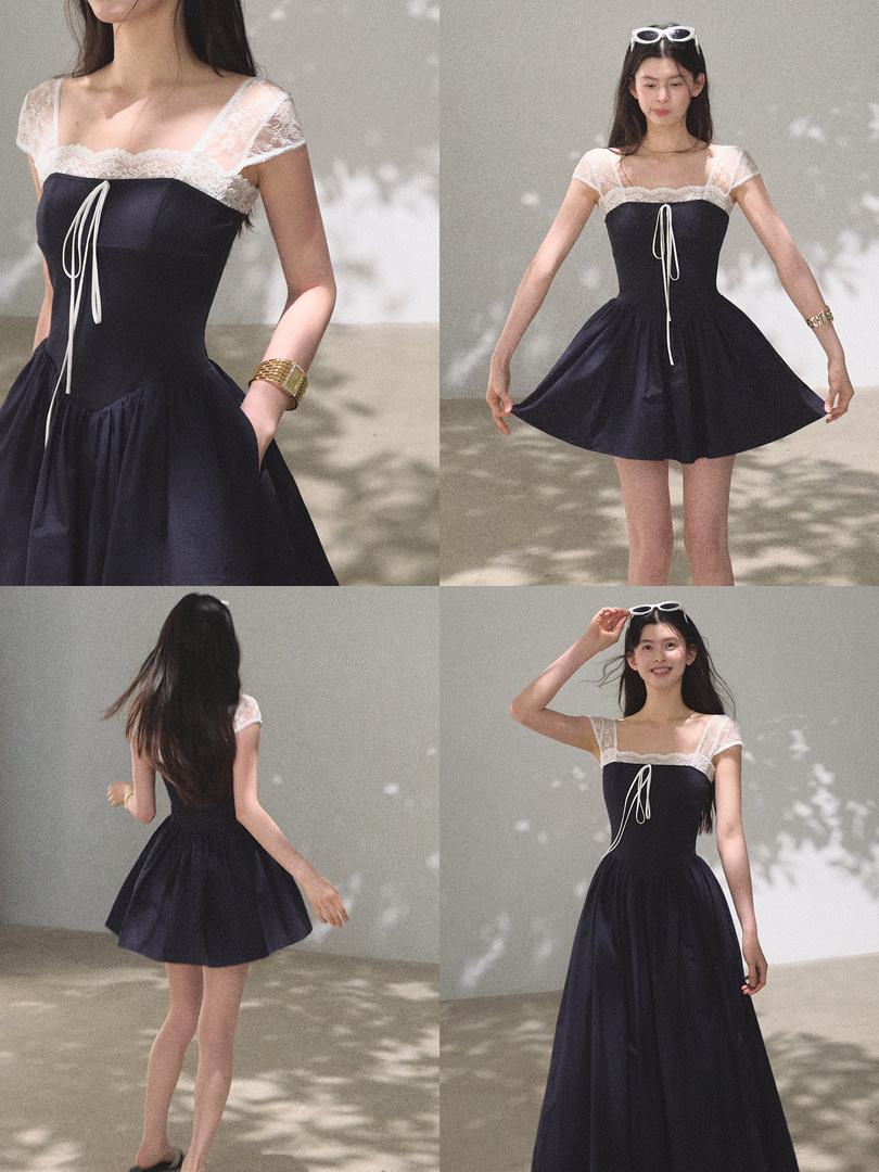 Navy and white lace dress worn by a model