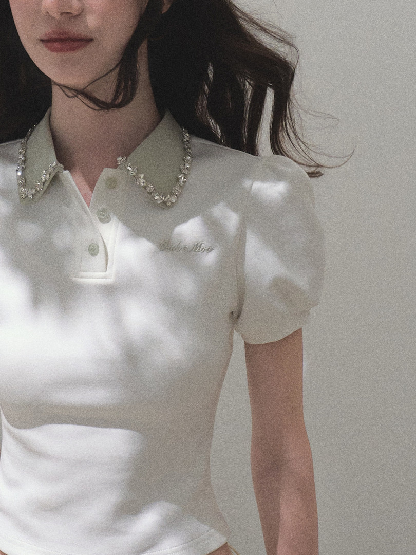 White short-sleeve collared polo shirt worn by a model