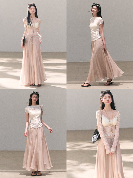 Woman wearing a sheer lace top with a flowing blush maxi skirt