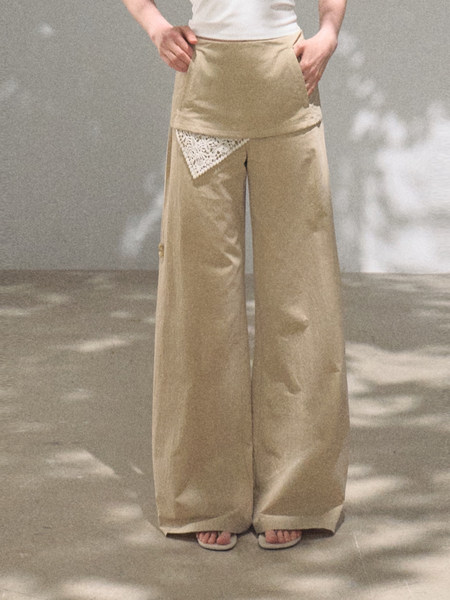 Beige wide-leg pants worn by a model