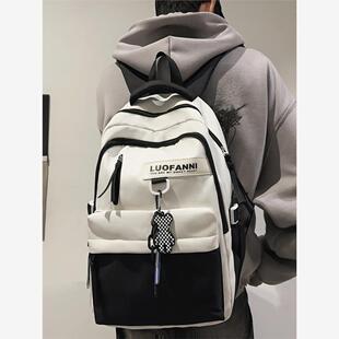 男女学生书包初中学生书包简易新款大容量防水小学生减压黑白背包