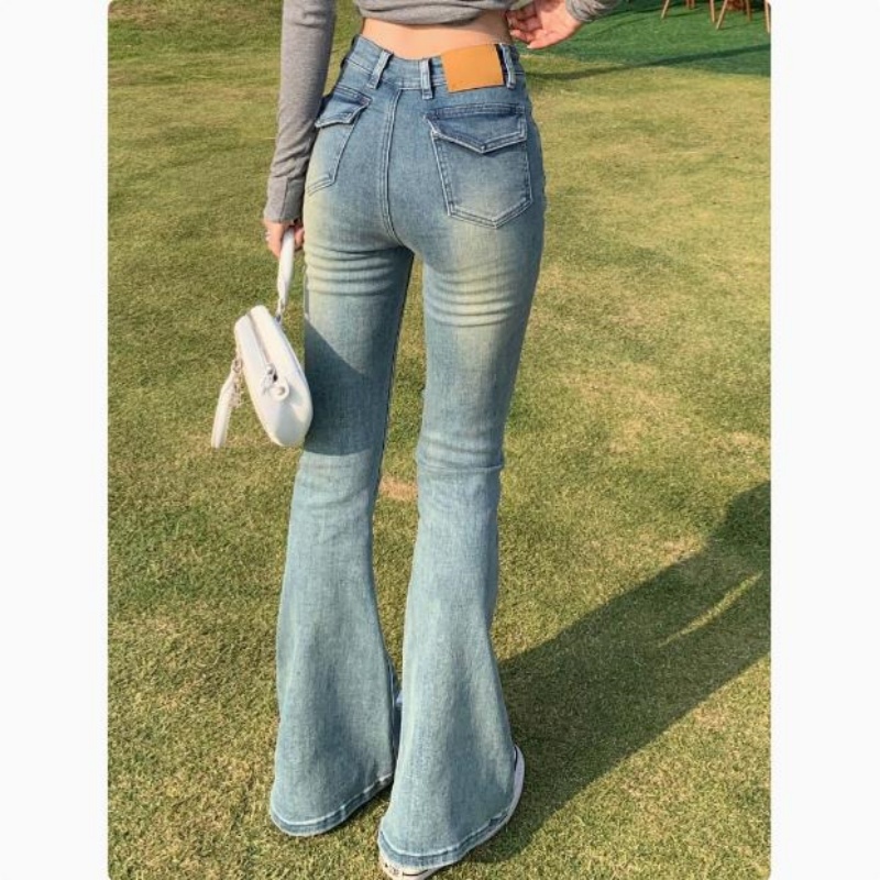 欧蓄浅蓝色V腰弹力微喇牛仔裤