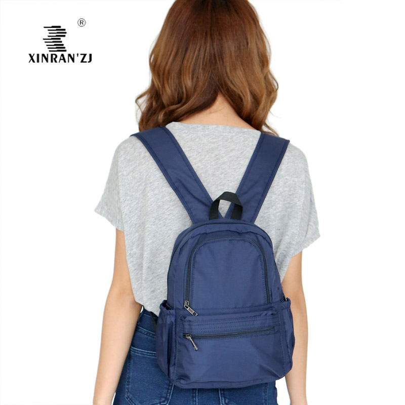 旅行多口袋休闲逛街夹层双肩背包