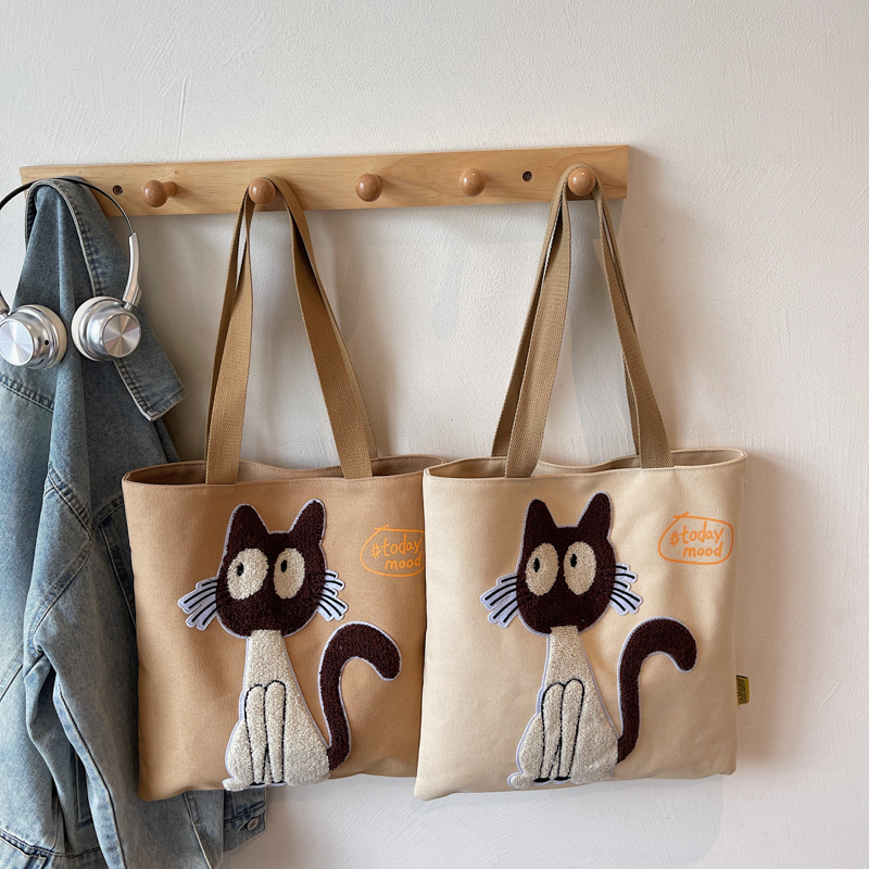 手拎布袋包学生通勤单肩装书书包