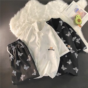 夏季男女1404-1-dk05-C33-p80宽松阔 裤短裤中裤休闲套装货图片