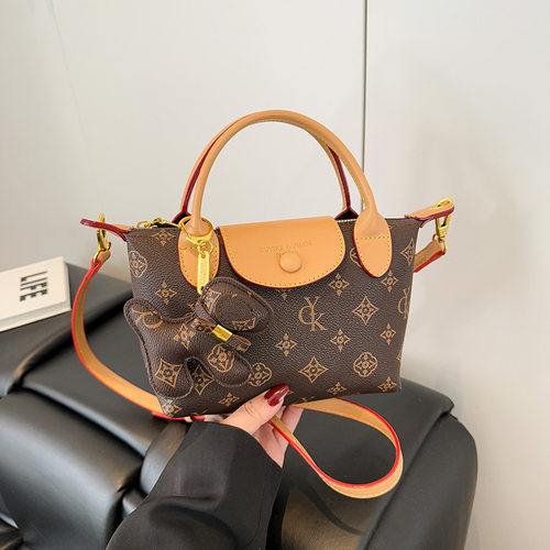 轻奢复古老花真皮小包2025新款百搭休闲迷你手提饺子包单肩斜挎包