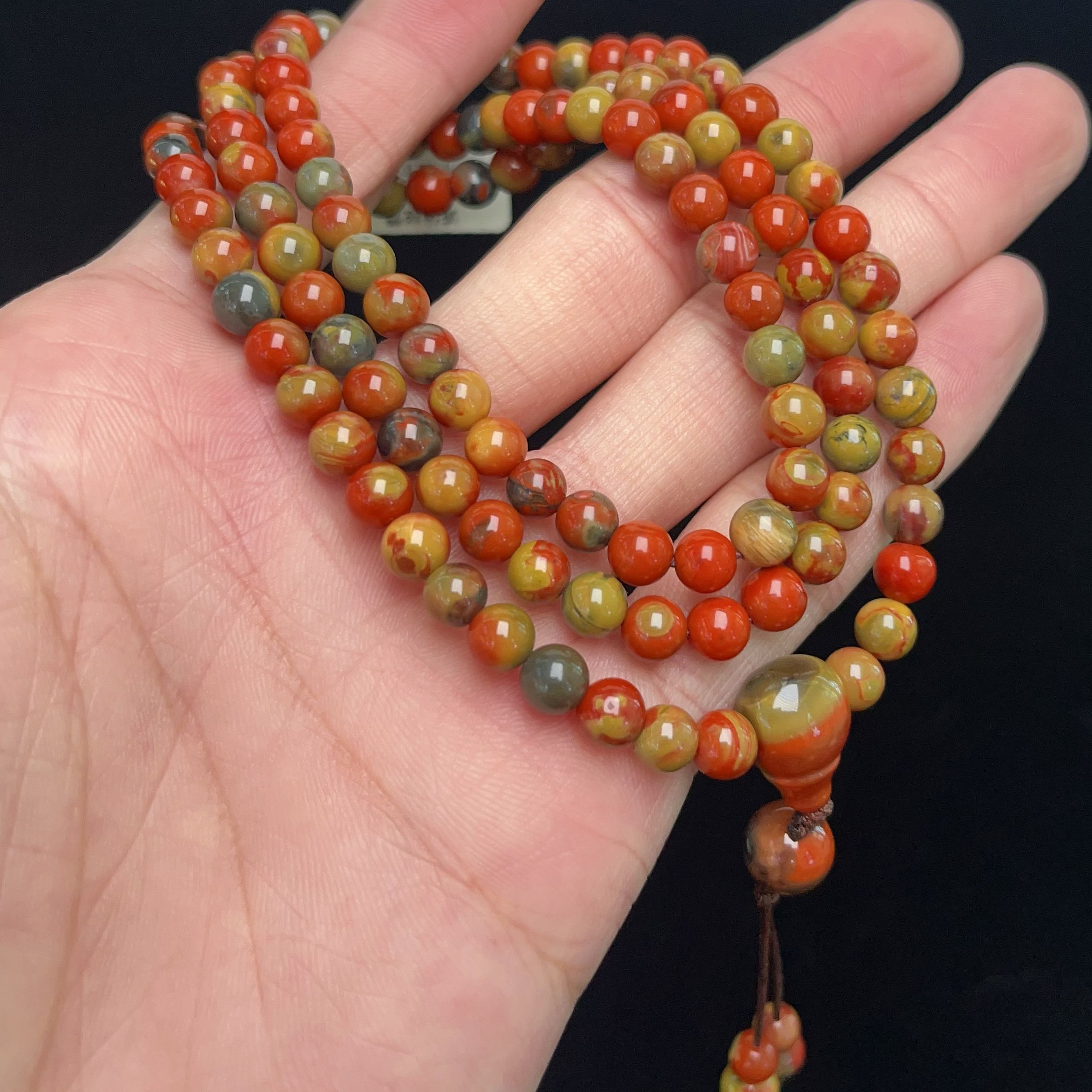 2306A03凉山九口料南红三彩包浆多圈手串