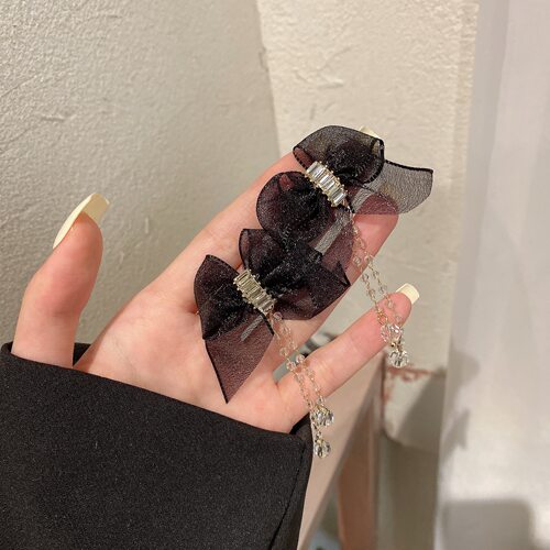 黑色蝴蝶结流苏复古女气质