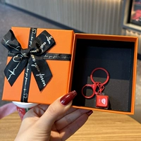 Электронная красная оранжевая подарочная коробка