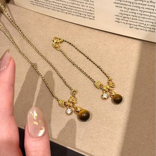 SSJEWELRY轻奢珠宝s925银镀金黑金编织秋冬虎眼葫芦跑环项链手链