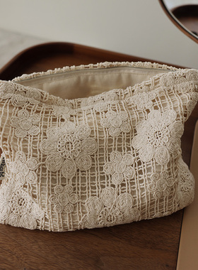 镂空花朵纯色布艺民族风收纳袋帆布百搭编织高雅气质时尚化妆包女