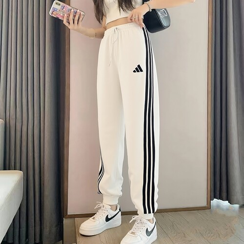 阿迪达斯白色运动裤女裤秋季新款休闲裤针织宽松三条纹小脚裤长裤