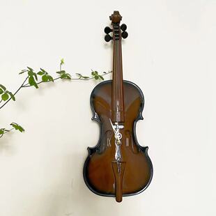 日本丽声RHYTHM小提琴造型光控报时客厅卧室餐厅音乐艺术个性挂钟