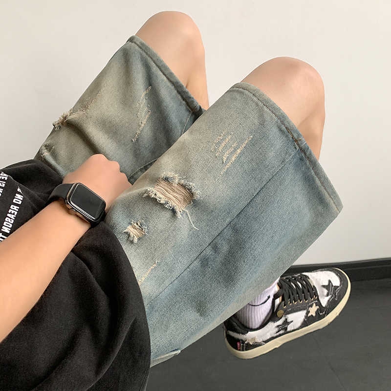 夏季薄款破洞牛仔短裤男直筒