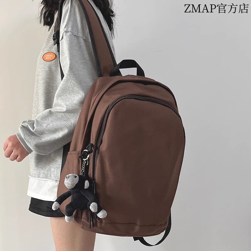 法国书包女简约轻便大容量护脊双肩包小众休闲电脑减负背包男