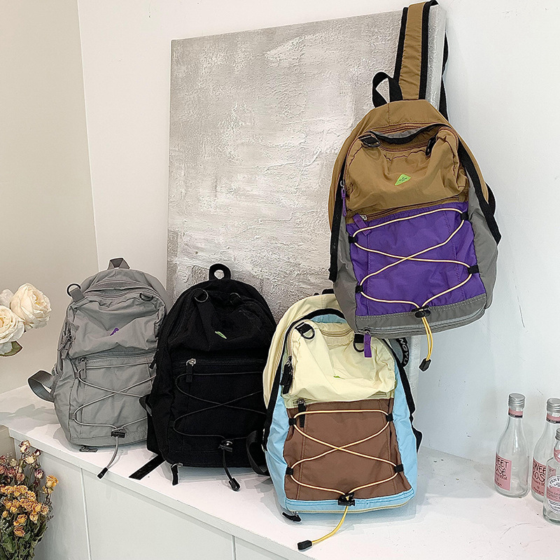 新款户外登山包徒步旅行包超轻防细雨耐磨大容量山系男女童双肩包