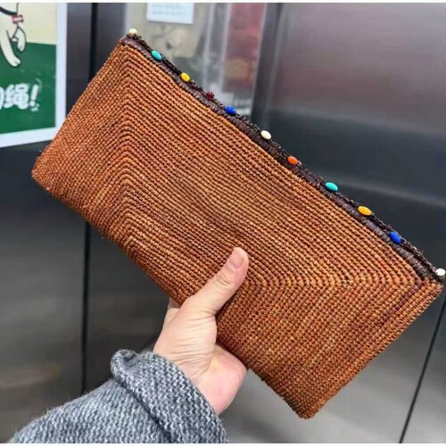 2026新款橘色手工拉菲草编制手拿包彩色拉珠便携包包