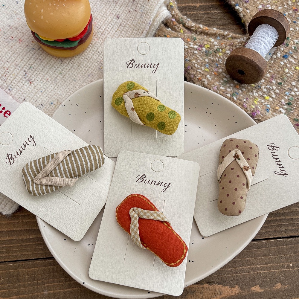 2025秋冬新款女童宝宝搞怪甜美可爱充棉拖鞋刘海侧边发夹头饰