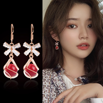 Red artificial pearl earrings 2020 new Korean fashion style long earrings women's simple autumn and winter earrings in South Korea
