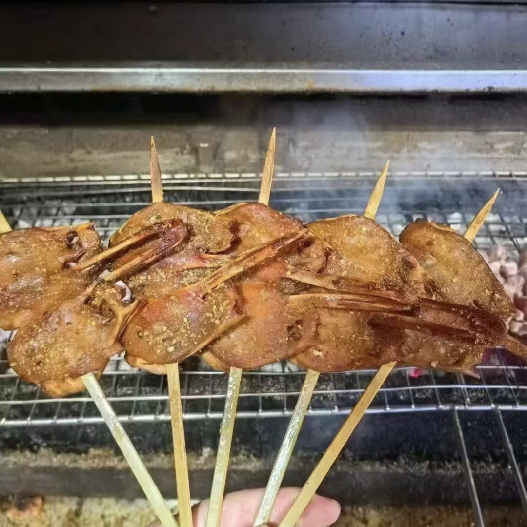 火箭鸭头烤鸭头劈开鸭头烧烤油炸小吃秘制卤味腌制鸭头串10串批发
