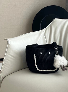 新款韩国东大门小众黑色大号手工编织俏皮可爱笑脸手提水桶包包女