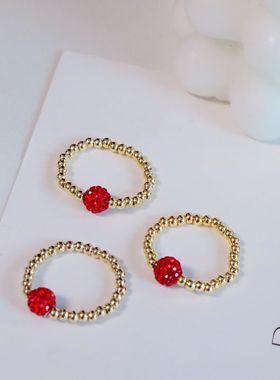 钛钢弹力戒指金豆子红色钻球