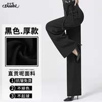 Плотные черные женские брюки с завязкой спереди.