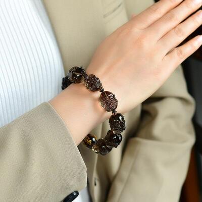 天然巴西茶水晶十八罗汉手链 双面雕刻规格20*20*18mm重84.2克ss0