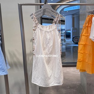UR&DC2025夏季新款休闲度假风贝壳装饰木耳边露背白色吊带连衣裙
