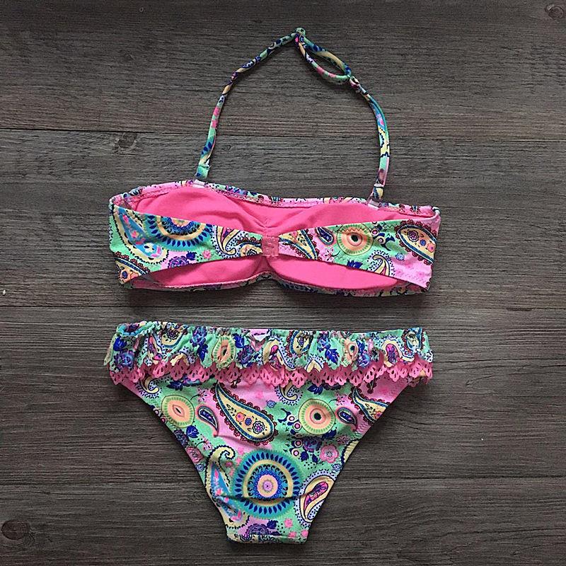 Printed children's bikini swimsuit with ruffled edges,