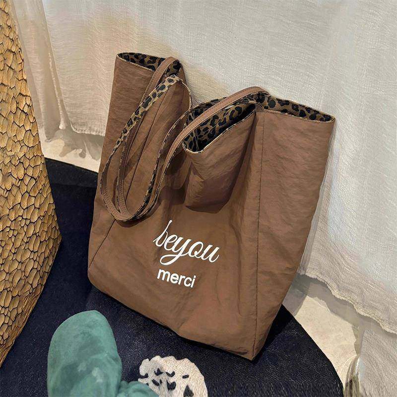 豹纹包包女款2025新款大容量帆布包双面轻便单肩包通勤百搭手提包