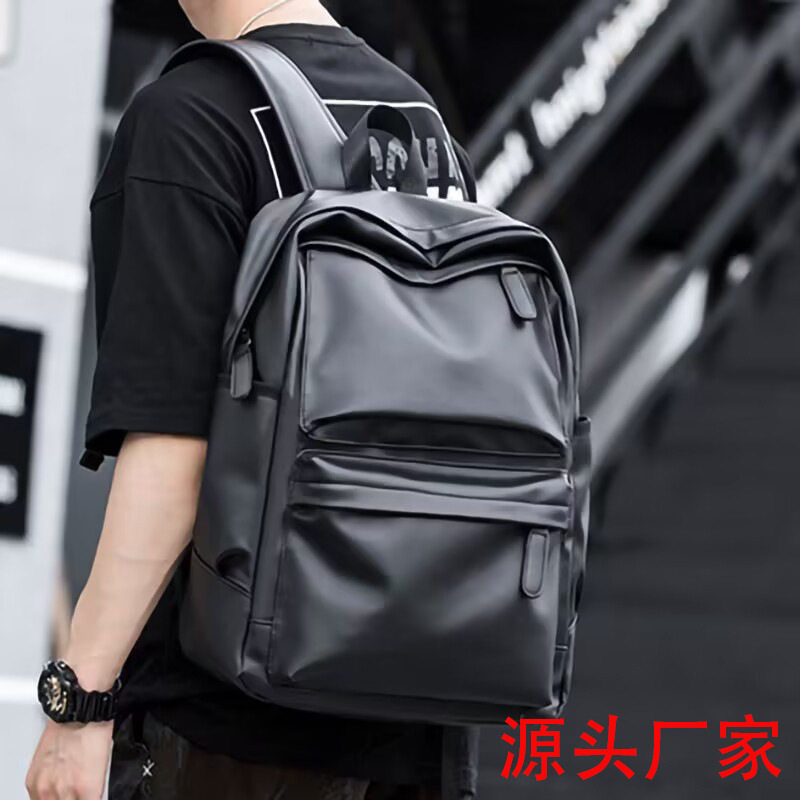 皮质双肩包男士2026新款旅游轻便背包书包初中生大学生小众电脑包