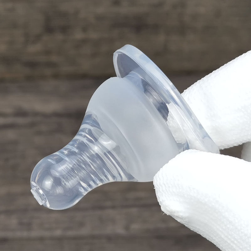 集 婴儿3.5cm标准口径奶嘴食品级硅胶宝宝防胀气圆孔十字孔耐高温