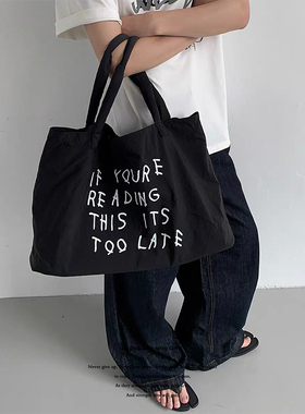 日系简约高级感百搭字母大容量托特包小众时髦设计师款黑色帆布包